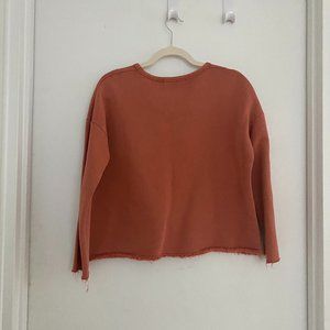 Oversized rusty orange sweater with fringes